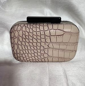 Small black and tan clutch